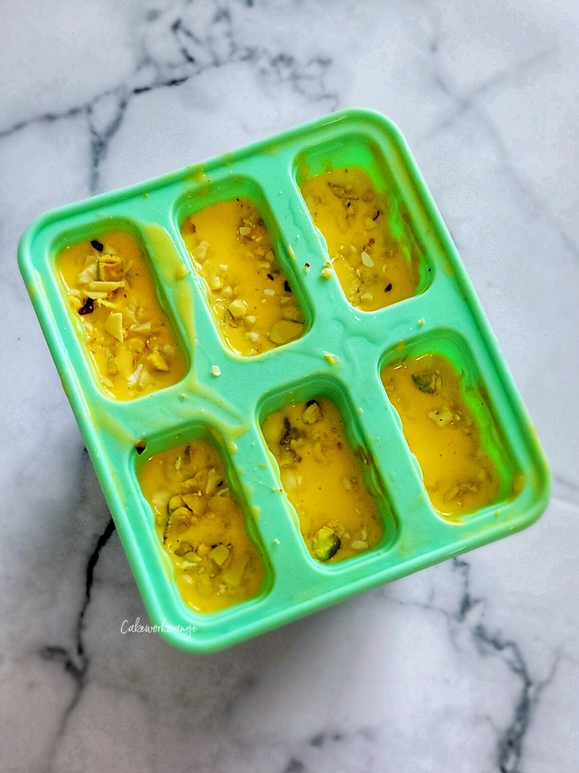 Transfer the mango mixture to popsicle mold and freeze overnight