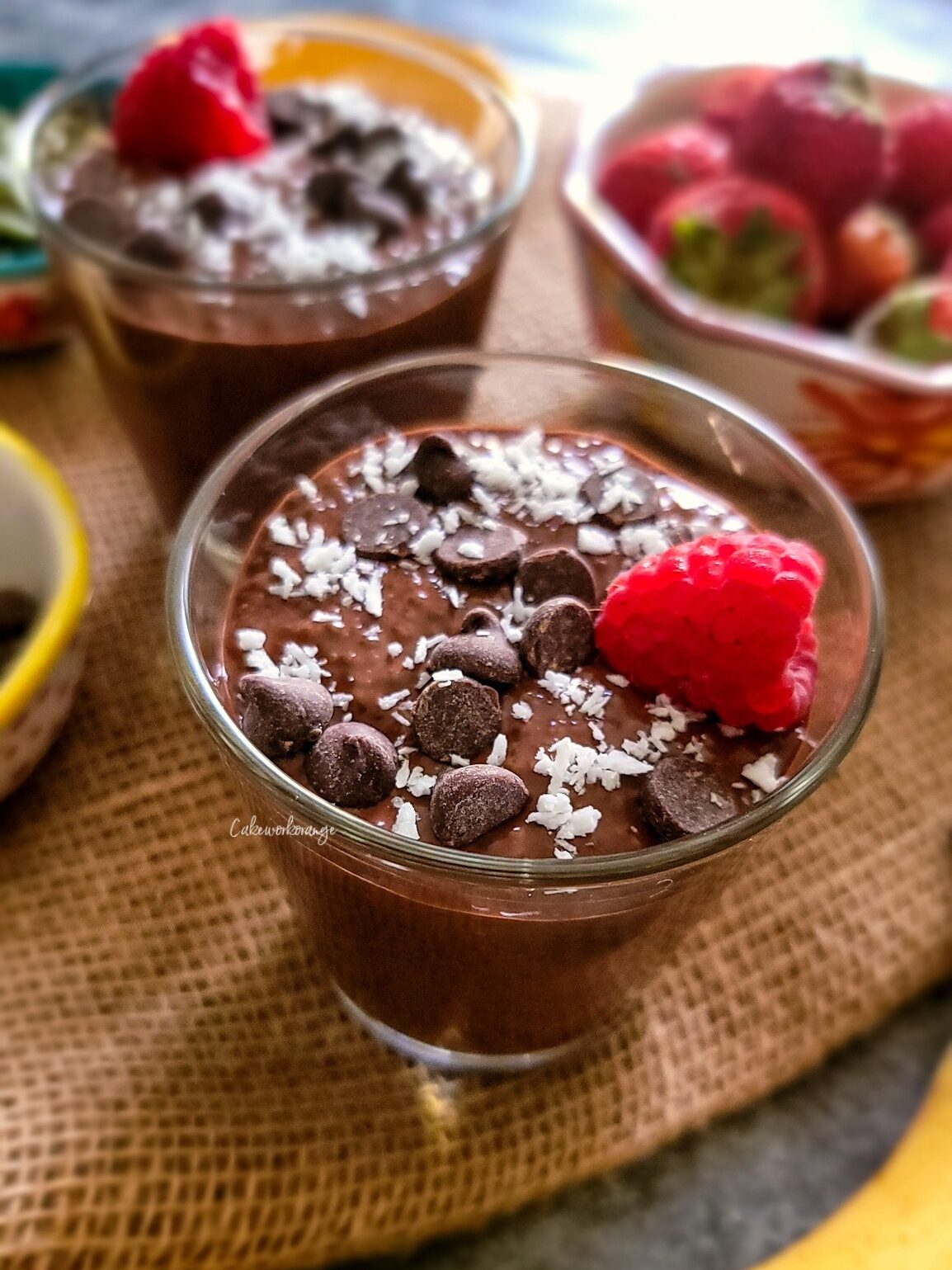Chocolate Chia Pudding topped with raspberry, chocolate chips and desiccated coconut