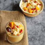 Indian style rich fruit custard with fresh fruits served in a serving glass for dessert time.