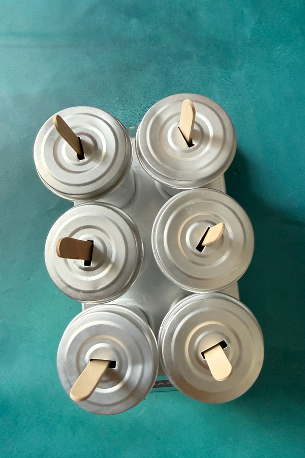 Malai kulfi getting ready to be frozen in kulfi mould
